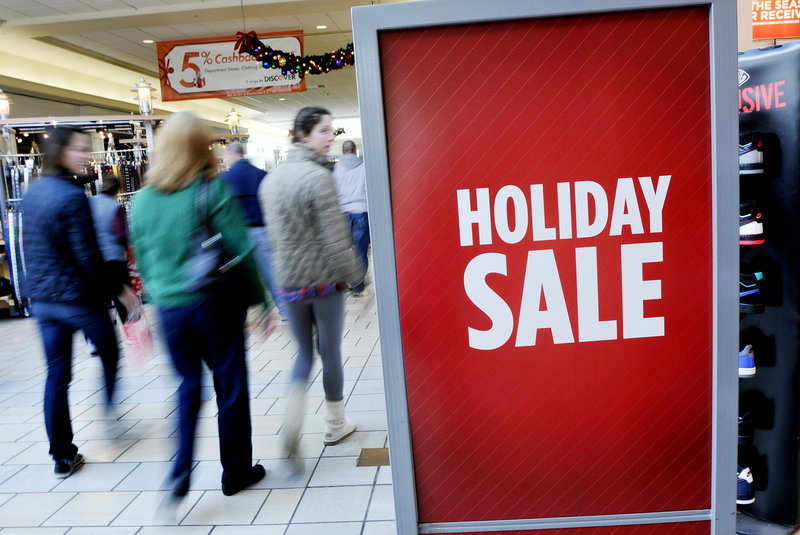 Shoppers browse at the Maine Mall on Wednesday. Many merchants say they expect a strong holiday shopping season.
