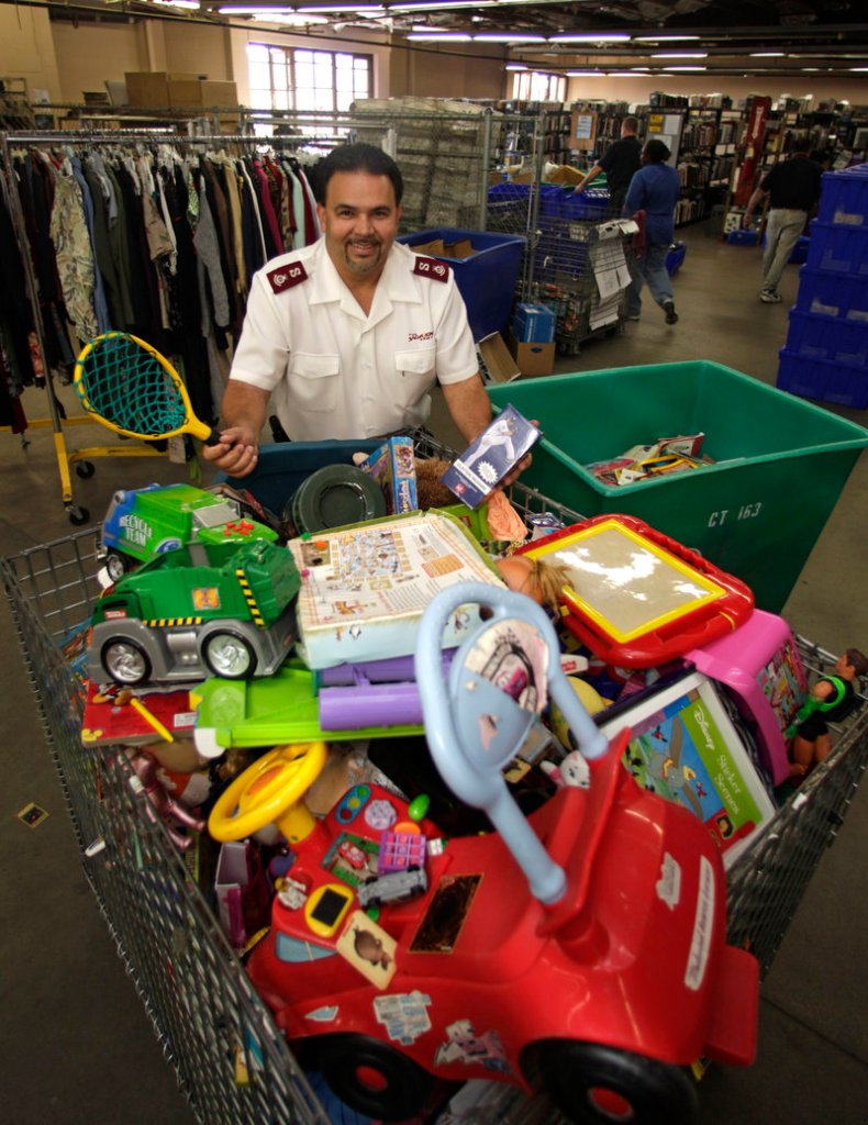 Salvation Army Maj. Henry Graciani shows toys that the San Diego, Calif., office hopes holiday shoppers might like.