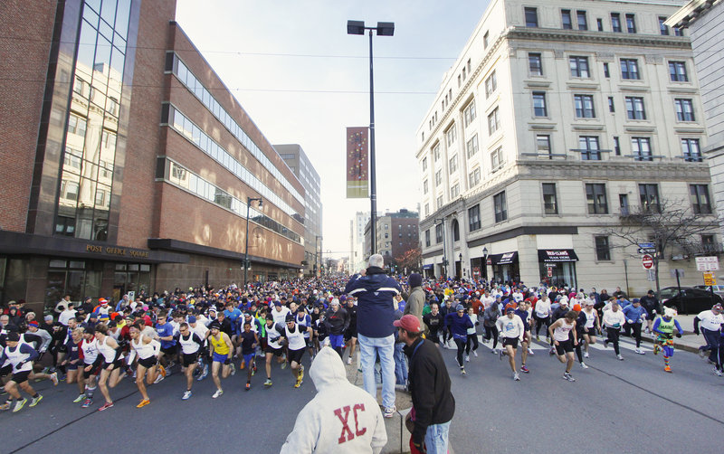 And off they go Thursday, the record field of 1,649 runners that participated in the annual Thanksgiving Day 4-miler, right near City Hall on Congress Street in downtown Portland.