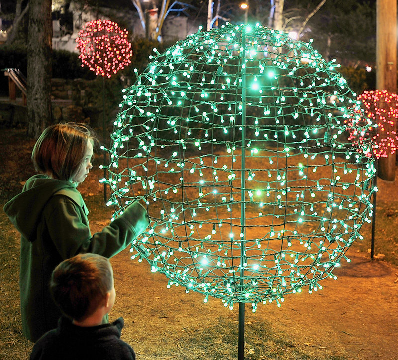 Natalie Wright, 9, of Woolwich and her cousin, Sawyer, 3, who is visiting from Colorado, are fascinated by light forms on the L.L Bean campus in Freeport.