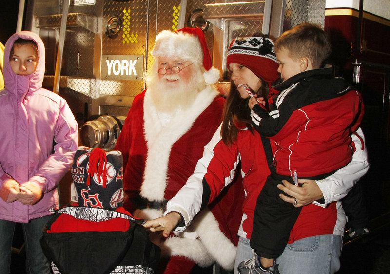 Children gather to talk to Santa Claus at the York event.