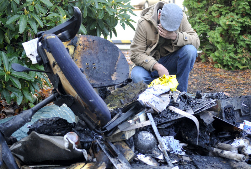 Ahson Saeed of Corvallis, Ore., looks over debris from a local Islamic center. Anger over a teenager’s failed plan to blow up a van of explosives during a Christmas tree lighting ceremony apparently erupted in arson at the center once frequented by the suspect.