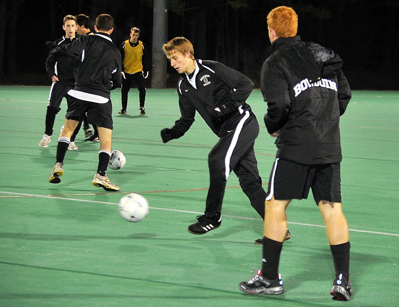 Macgill Eldredge, center, of Cumberland and his Bowdoin teammates practice Monday night in preparation for their NCAA Division III men's soccer semifinal Friday in San Antonio against Lynchburg College. The Polar Bears are making their first appearance in the Final Four.
