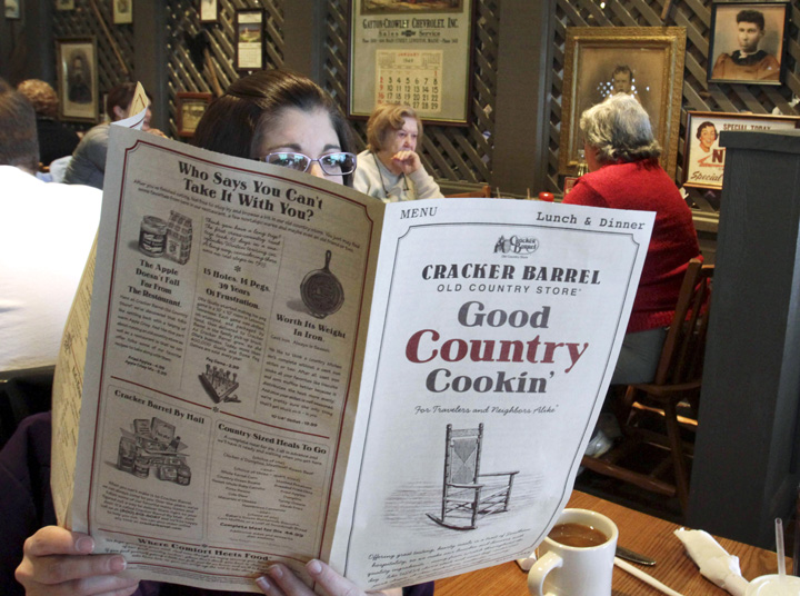 Sonja Woods of Shapleigh reads the menu recently at the Cracker Barrel restaurant and store in South Portland.