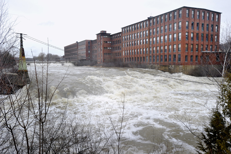 High water on the Presumpscot River flows over Westbrook's Saccarappa Falls following last night's heavy rains.