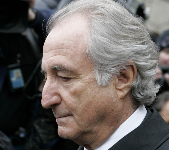 Massachusetts businessman and philanthropist Carl Shapiro was an early investor in the investment business of Bernard Madoff, who is shown here in a March 2009 photo.