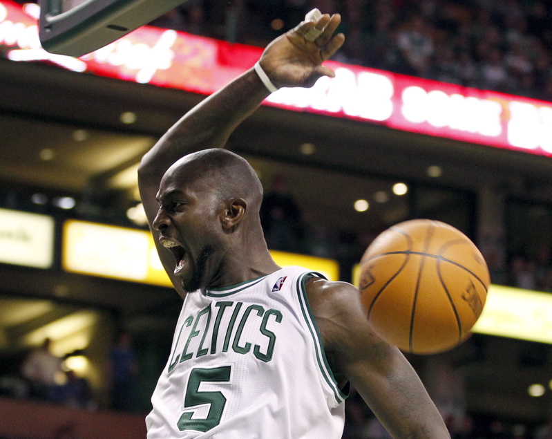 Kevin Garnett of the Celtics yells after dunking the ball against the Indiana Pacers during the first half Sunday in Boston. The Celtics won 99-88.