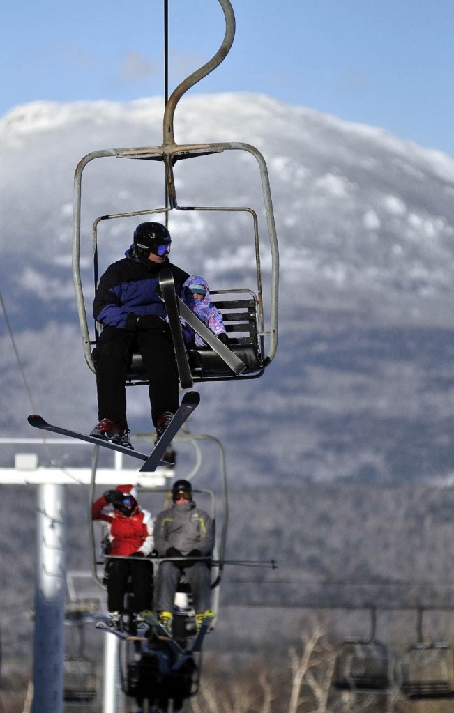 Skiers ride a chairlift Tuesday afternoon at Sugarloaf. A lift derailed in high winds at Maineâs tallest ski mountain Tuesday, sending skiers plummeting as far as 30 feet to the slope below and injuring several people.