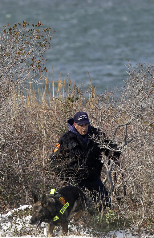 Police search the narrow strip of land on Long Island, N.Y., that divides the Great South Bay from the Atlantic Ocean. A four-lane parkway runs through the middle, connecting Jones Beach State Park with several state and town-run beaches to its east.