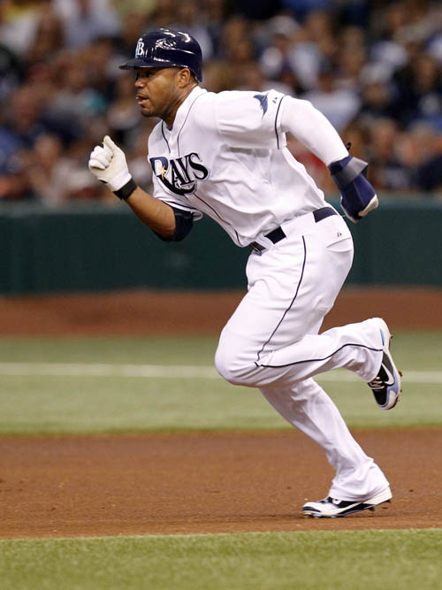 A July 31, 2010, photo showing Tampa Bay Rays' Carl Crawford stealing his 400th career base in the first inning of a baseball game against the New York Yankees, in St. Petersburg, Fla.