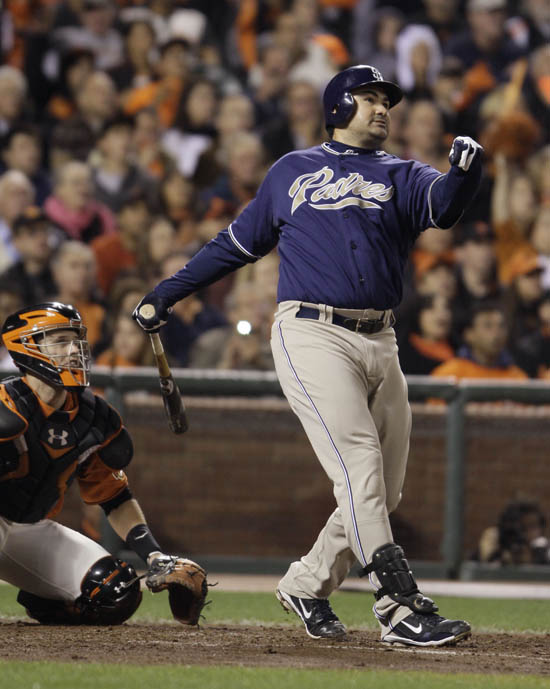 In this Oct. 1, 2010, photo San Diego Padres' Adrian Gonzalez hits a three-run homer in a game against the San Francisco Giants.