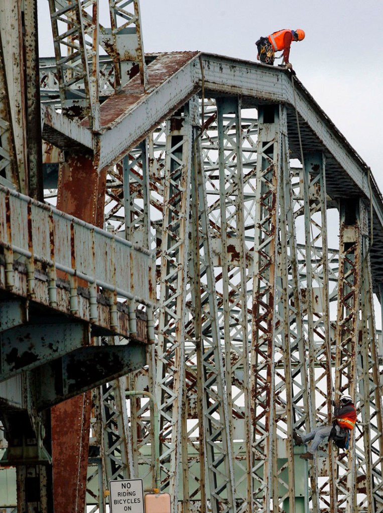 In this Nov. 30, 2010, photo, New Hampshire transportation officials inspect the Memorial Bridge connecting Portsmouth, N.H., with Kittery, Maine. The bridge, which opened in 1923, was closed today due to structural deterioration.