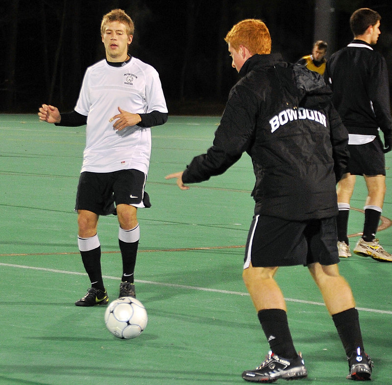 Eddie Jones, left, works with teammate Zach Ostrup as Bowdoin prepares for the NCAA Division III semifinals this weekend. Jones is a key to the Polar Bears’ midfield play.