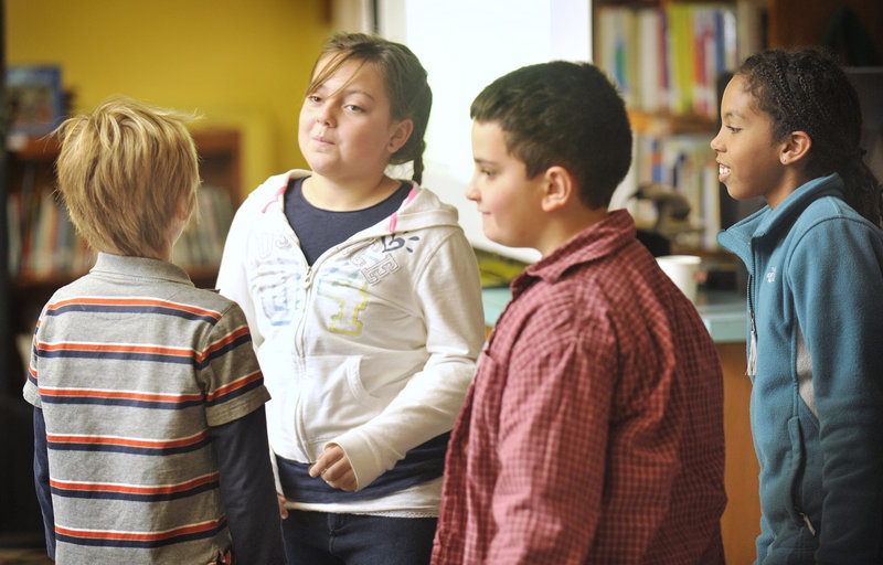 Students Nate Perkins, from left, Maddalena Lapomarda, Vincent Terracciano and Ella Altidor take part in a role-playing scenario on self-esteem Wednesday at Hall Elementary School in Portland.