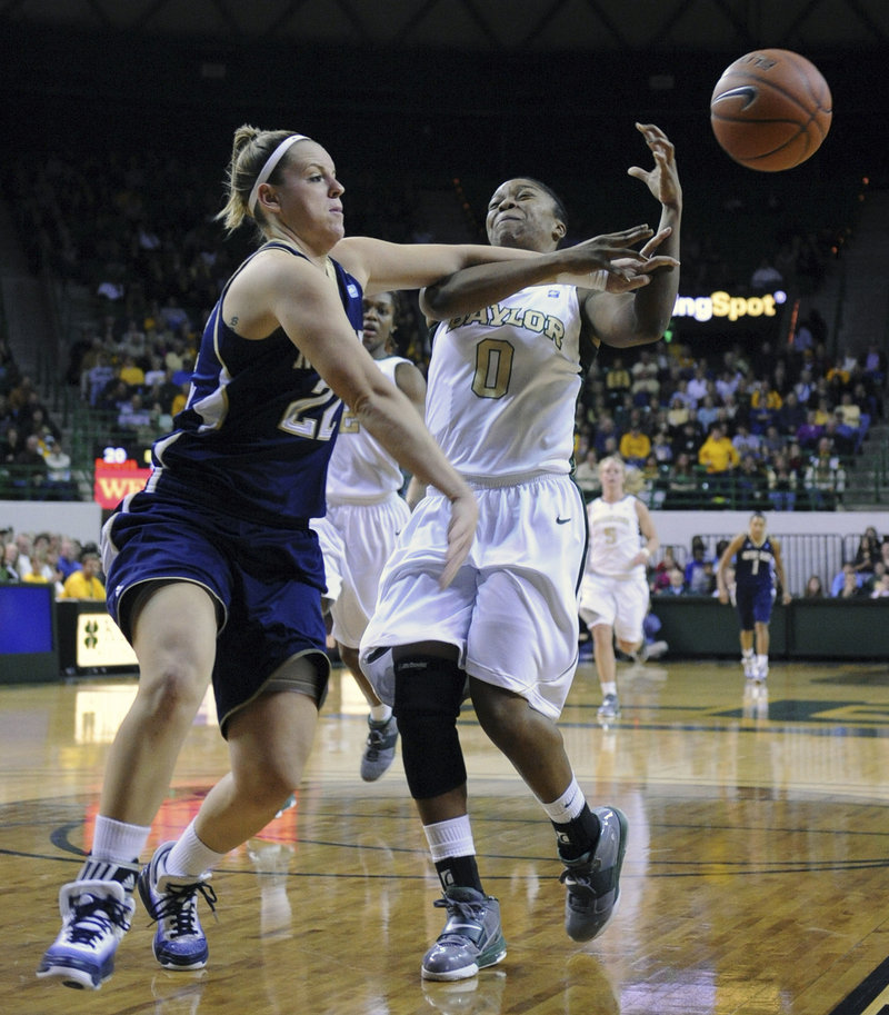 Natalie Novosel, left, of Notre Dame knocks the ball away from Baylor’s Odyssey Sims during Wednesday night’s game at Waco, Texas. No. 2 Baylor won, 76-65.