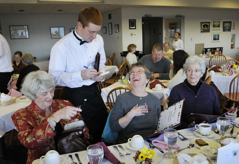 Jeremy Gearly of Lebanon takes orders at Southern Maine Community College as part of the dining room management program. Guests, from left, are Sheila Brown and Rita Landry, both of Westbrook, and Gracia Largay of Cumberland Foreside.