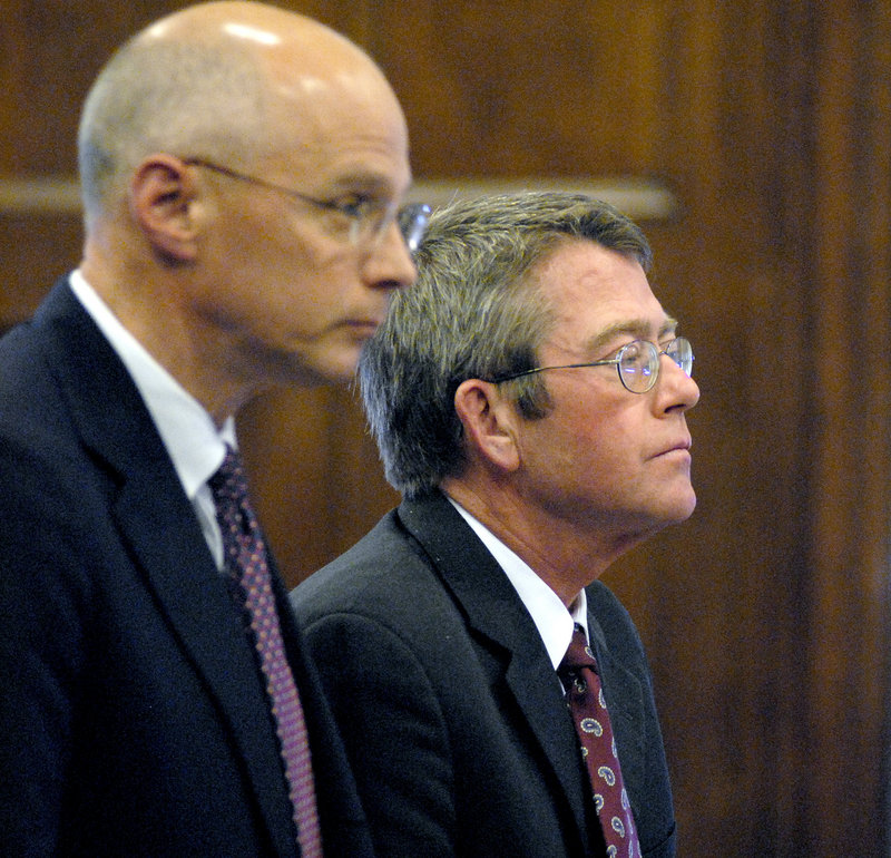 John D. Duncan, at right, stands with his attorney, Toby Dilworth, as he is sentenced in September 2008 in Cumberland County Superior Court in Portland for stealing almost $300,000 from clients and his former law firm, Verrill Dana.