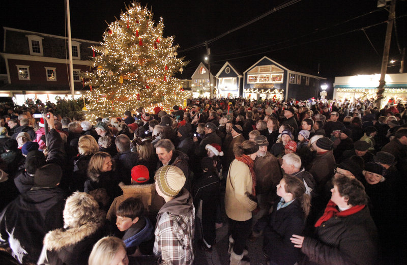 People crowd Dock Square in Kennebunkport for a tree lighting ceremony during Christmas Prelude on Friday. This weekend is the start of the town's 29th annual Christmas Prelude, which runs through next weekend.