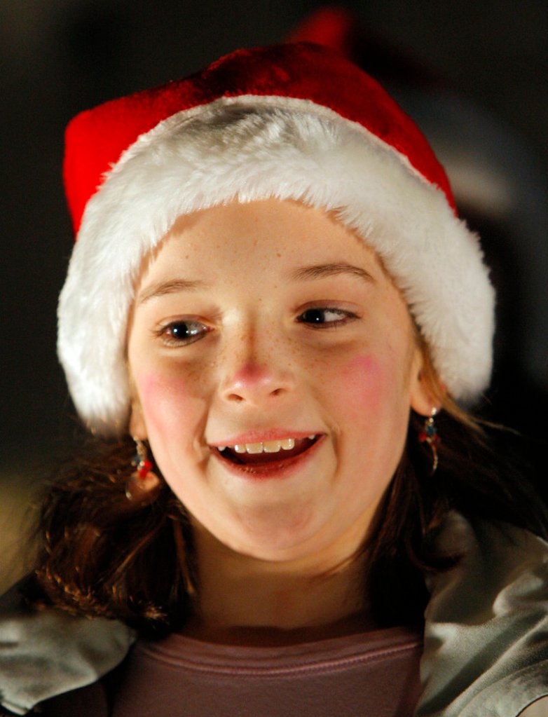 Samantha Creech, 10, sings a Christmas carol Friday night with a group from Academy of Developing Artists of Maine, based in Biddeford.