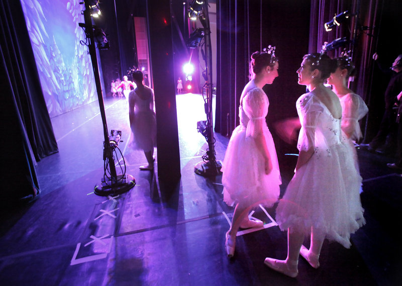 Girls who are dancing the role of Snowflakes wait their cue at Saturday afternoon's performance of "The Nutcracker" by the Maine State Ballet at Merrill Auditorium.