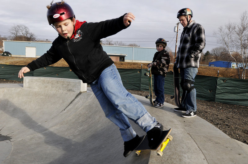 Nate Hanson, 8, of Freeport works on his skills at the skatepark on a visit there with his father, Kris Hanson, and friend, Vito LaVopa. “This is our thing. It’s something we do together,” said Kris.