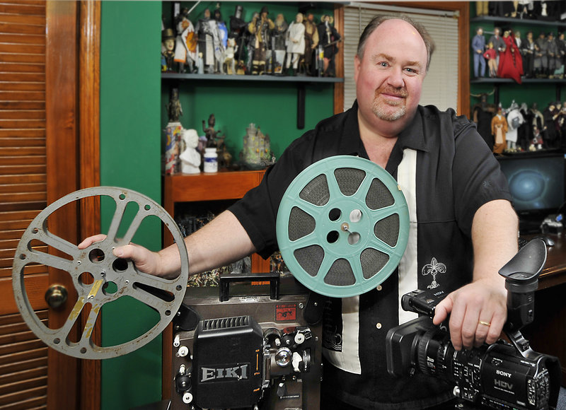 Reggie Groff of Falmouth transfers old films to digital format by screening films on his old Eiki projector and recording it on a high-resolution video camera. He says orders to transfer old family films to DVDs increase during the holiday season.