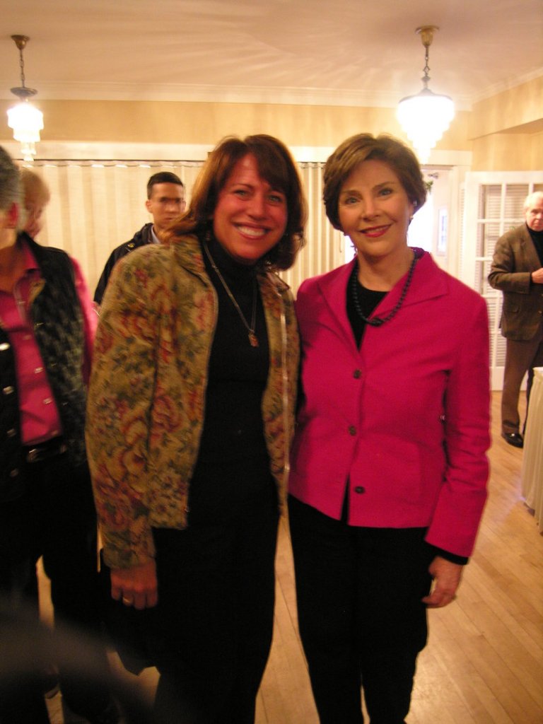 Former first lady Laura Bush poses with Maine Buck Nuts owner Sheila Speckin during a fundraiser at the Nonantum Resort in Kennebunkport on Saturday. The event was to benefit the "Sweets for the Troops" campaign to send packages of fudge and nuts to the soldiers stationed overseas for Christmas.