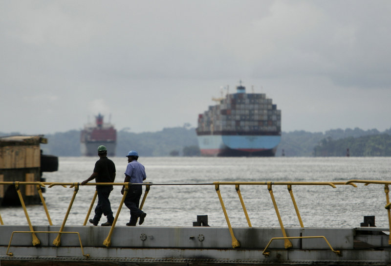Two Panama Canal workers walk over water gates in Gatun Lock. The canal was among several key shipping channels identified in U.S. State Department cables as among hundreds of potential targets for terrorist attacks. The list of targets is among secret documents released in recent days by the WikiLeaks website.