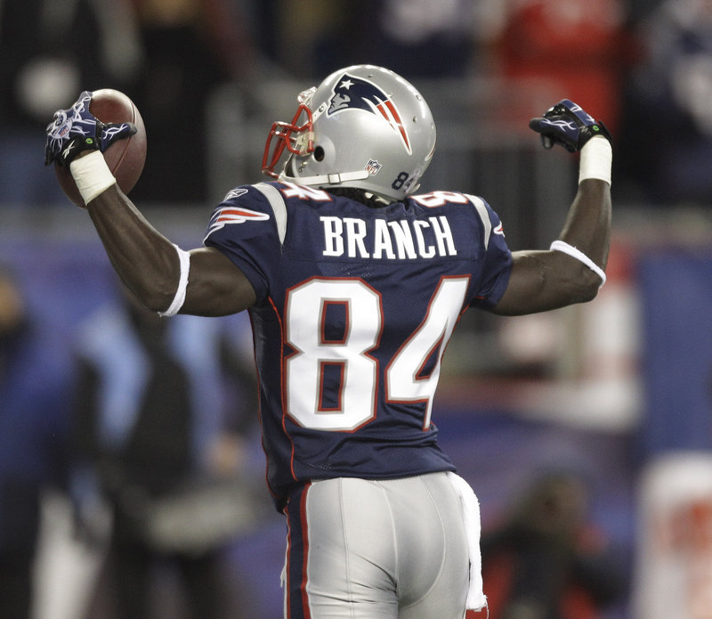 Deion Branch celebrates after scoring a touchdown against the New York Jets. The Patriots trounced the Jets 45-3 Monday in a showdown between two of the best teams in the AFC. Branch had three catches, while Tom Brady threw for 326 yards and four touchdowns.