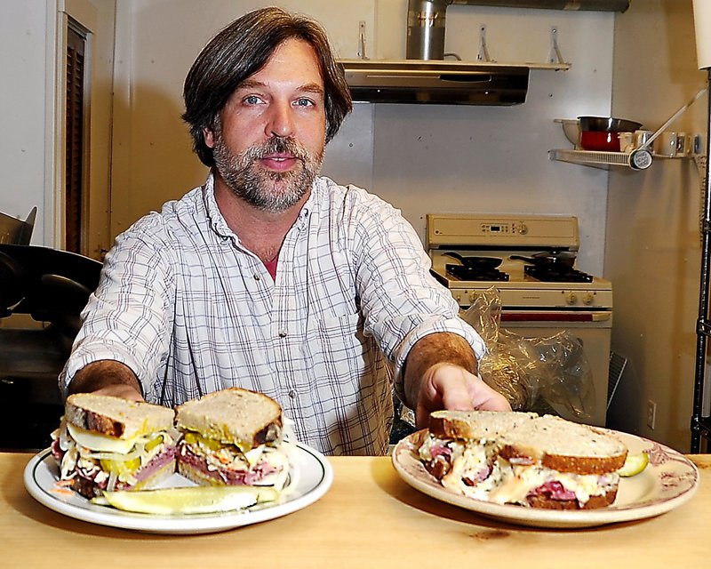 Owner Sumner Richards serves up a a Hard Luck Johnny, left, and a Corned Beef and Cabbage Reuben.