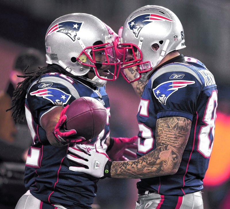 BenJarvus Green-Ellis, left, celebrates with tight end Aaron Hernandez after scoring Monday night for the Patriots. There was plenty to celebrate, but four games still remain.