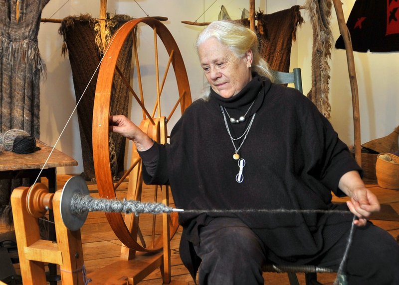 Katharine Cobey spins yarn the old-fashioned way in her Cushing studio.