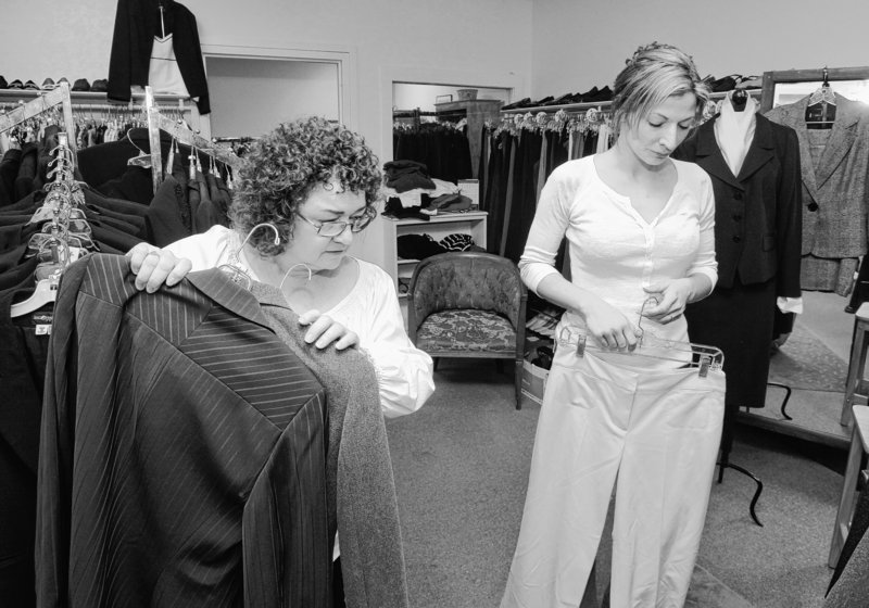 Sharon Orlando, left, assists Jillian Veilleux at Dress for Success in Portland last month. The nonprofit boutique outfits women who need proper business clothes to wear for job interviews but can’t afford them.