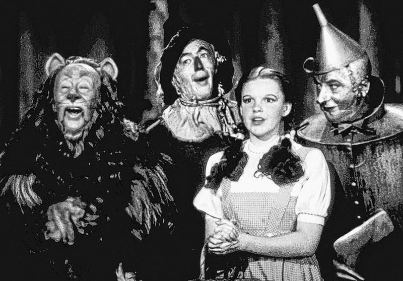 The “Oz” cast, from left: Bert Lahr as the Cowardly Lion, Ray Bolger as the Scarecrow, Judy Garland as Dorothy, and Jack Haley as the Tin Woodman.