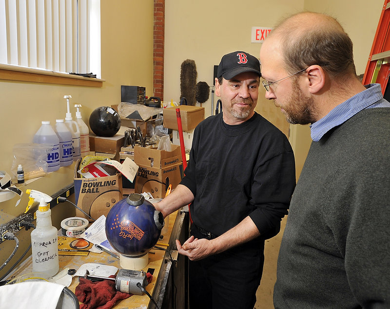 Reporter Ray Routhier learns about plugging a bowling ball with epoxy and drilling new holes for a new grip from Steve Closuit at Bayside Bowl in Portland.