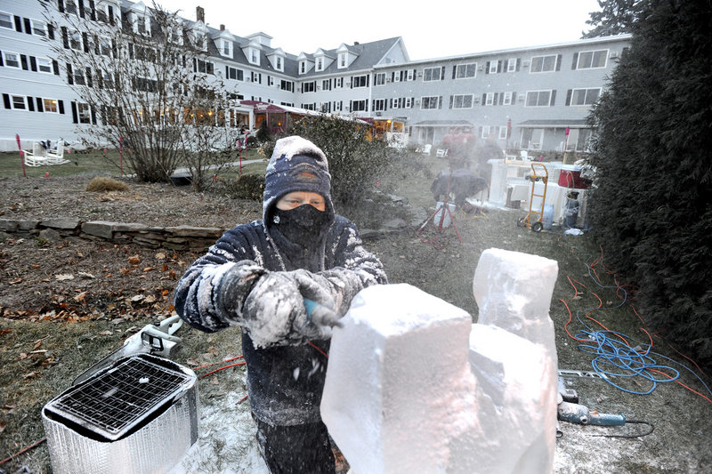 Ice sculptor Ed Jarrett carves a lobster from a block of ice for the Fire & Ice Bar fundraiser on Friday.