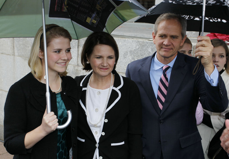 Elizabeth Smart, left, along with her mother and father, addresses the media outside federal court in Salt Lake City Friday, following a guilty verdict in the trial of her kidnapper.