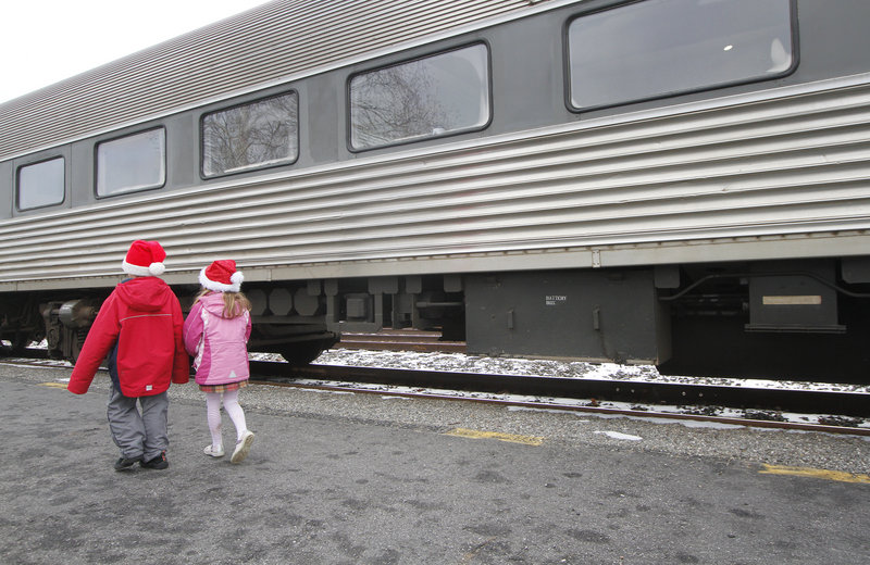 Seth Dixon of Falmouth and Grace McNally of North Yarmouth, both 6, head for the train.