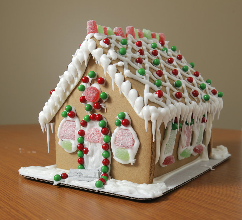 The Wilton gingerbread house, available at Hannaford and Walmart, was one of four assembled from kits by our columnist and presented to judges from our staff.
