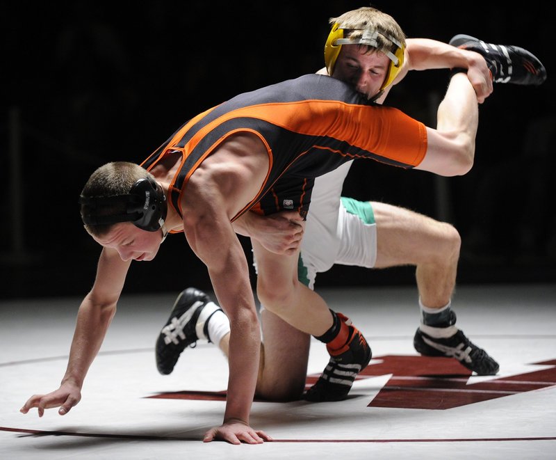 Ethan Gilman, back, of Massabesic, defeated Brunswick’s Jared Jensen, front, in the Class A 119-pound final last season, but they’ll be competing in different weight classes this winter.