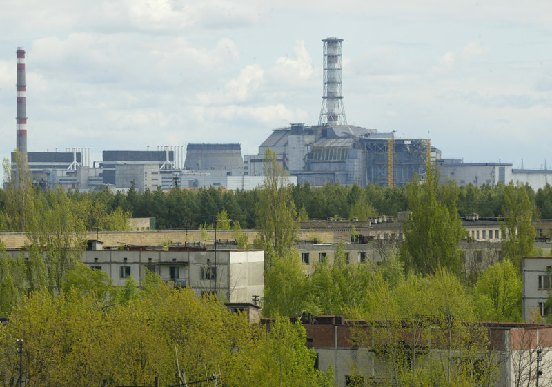 The Chernobyl nuclear power plant looms over empty houses in the town of Pripyat, Ukraine. Next year, the government will open the contaminated zone around the reactor to visitors who want to learn more about the nuclear tragedy that occurred there in 1986.