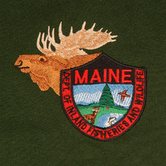 Wildlife T-shirts in warden green come embroidered with the Maine Department of Inland Fisheries and Wildlife insignia.
