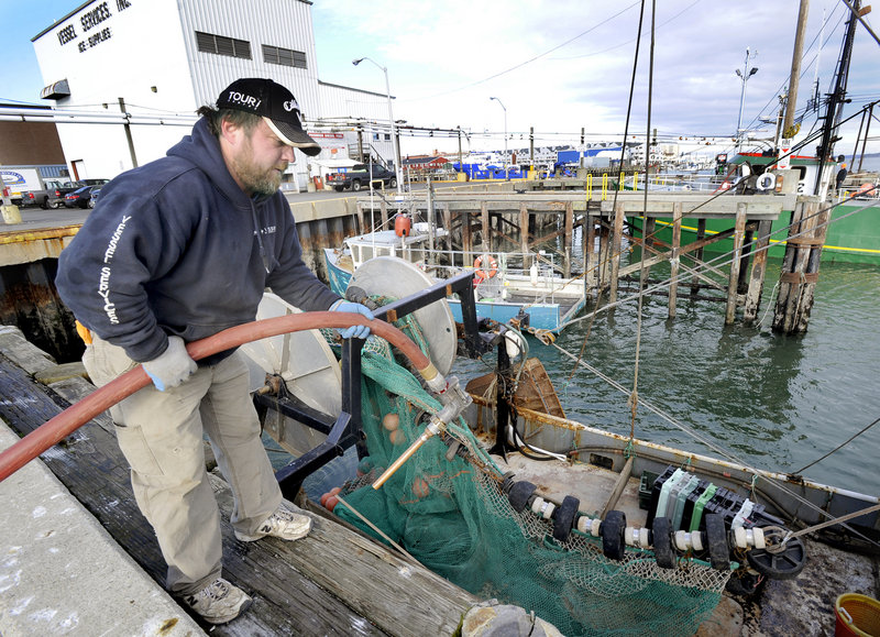Capt. Dana Hammond fuels his dragger the Nicole Leigh on Tuesday at Vessel Services on the Portland Fish Pier.