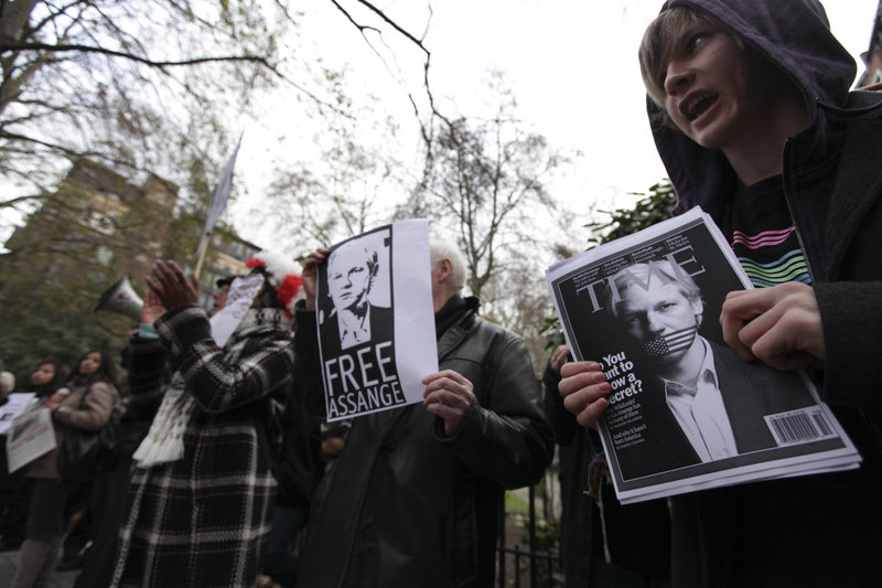 Protesters show support for Julian Assange outside Westminster Magistrates Court in London on Tuesday. The WikiLeaks founder appeared in a London court, seeking to fight his extradition to Sweden in a sex-crimes investigation.