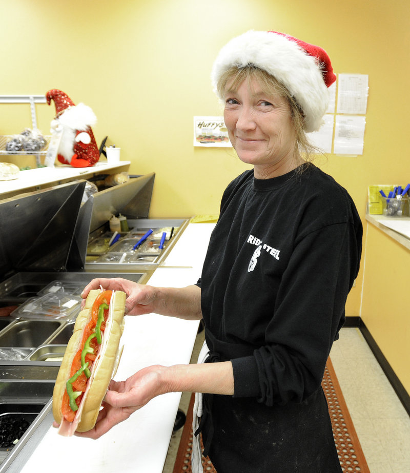 Pam Napolitano makes an Italian sandwich at Huffy's Sandwich Shop in Yarmouth.