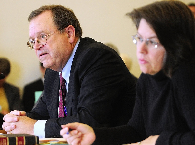 Secretary of the Senate Joseph G. Carleton Jr., left, and Clerk of the House Heather J.R. Priest meet with the Rules Committee on Wednesday at the State House in Augusta.