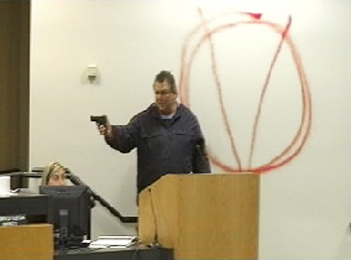 One line for cutline goes to book asjfl;kjasdlk fjasd In this image taken from video and released by WJHG-TV, Clay A. Duke points a hand gun at Bay City school board members and staff, Tuesday, Dec. 14, 2010. Duke, a 56-year-old ex-convict, calmly held the school board at gunpoint and said he was seeking redress for his wifes firing before shooting at the superintendent at short range and then killing himself. (AP Photo/WJHG-TV) MANDATORY CREDITThe Associated Press