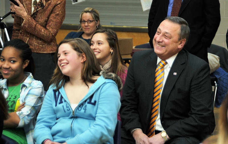 Governor-elect Paul LePage joins a class of eighth-graders Thursday as they watch a slide show with music, dialogue and acting by students outlining his past campaign for governor. “When experts talk about authentic learning, this is it,” said Superintendent Jim Morse.