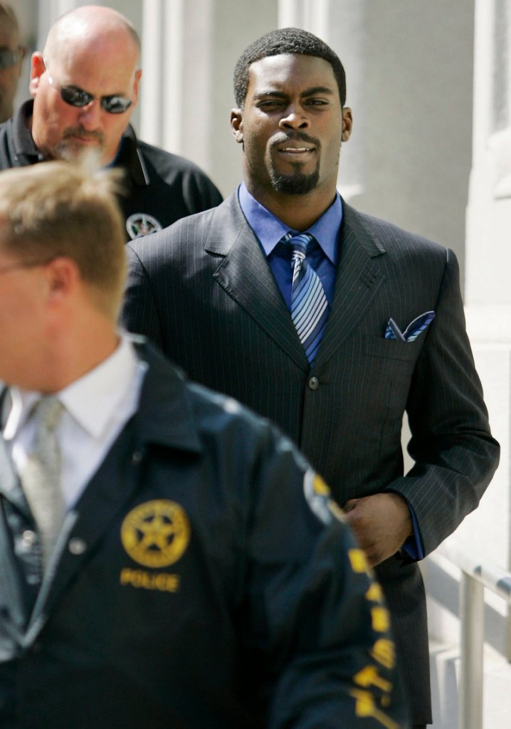 Michael Vick, right, who served 18 months in prison on dogfighting charges, is not allowed to own a dog until his probation ends in May 2012.