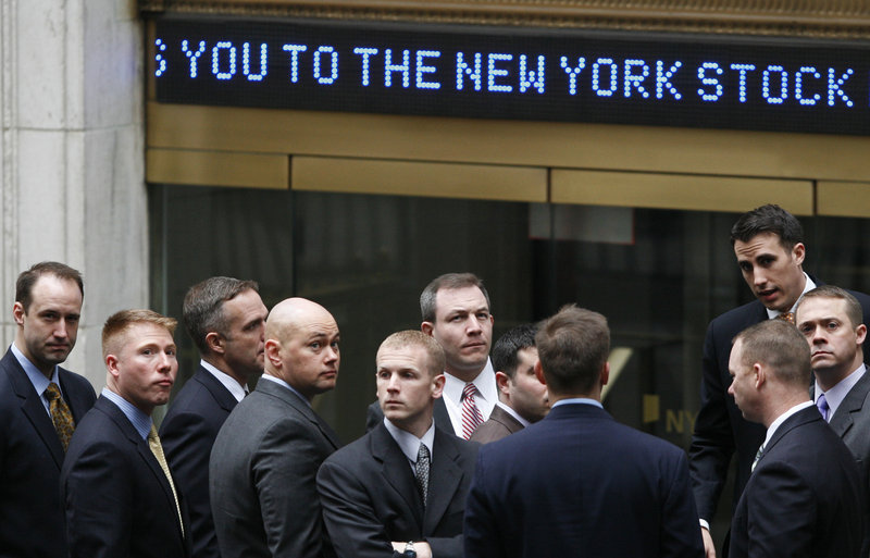 2009 Associated Press file This is a two-lin In this March 9, 2009 file photo, businessmen arrive at the New York Stock Exchange. Fear and panic enveloped the stock market and the Dow Jones industrial average plunged to 6,547 on March 9. Many investors thought it would take a decade or longer to get back to the record of 14,165, set on Oct. 9, 2007. Now we could be on the verge.